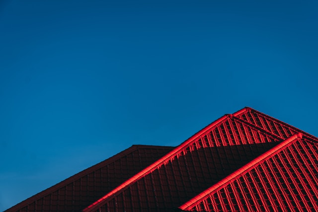 a red roof against a blue sky